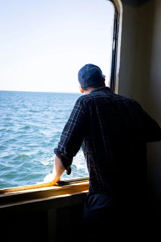 a man watches the ocean from a boat