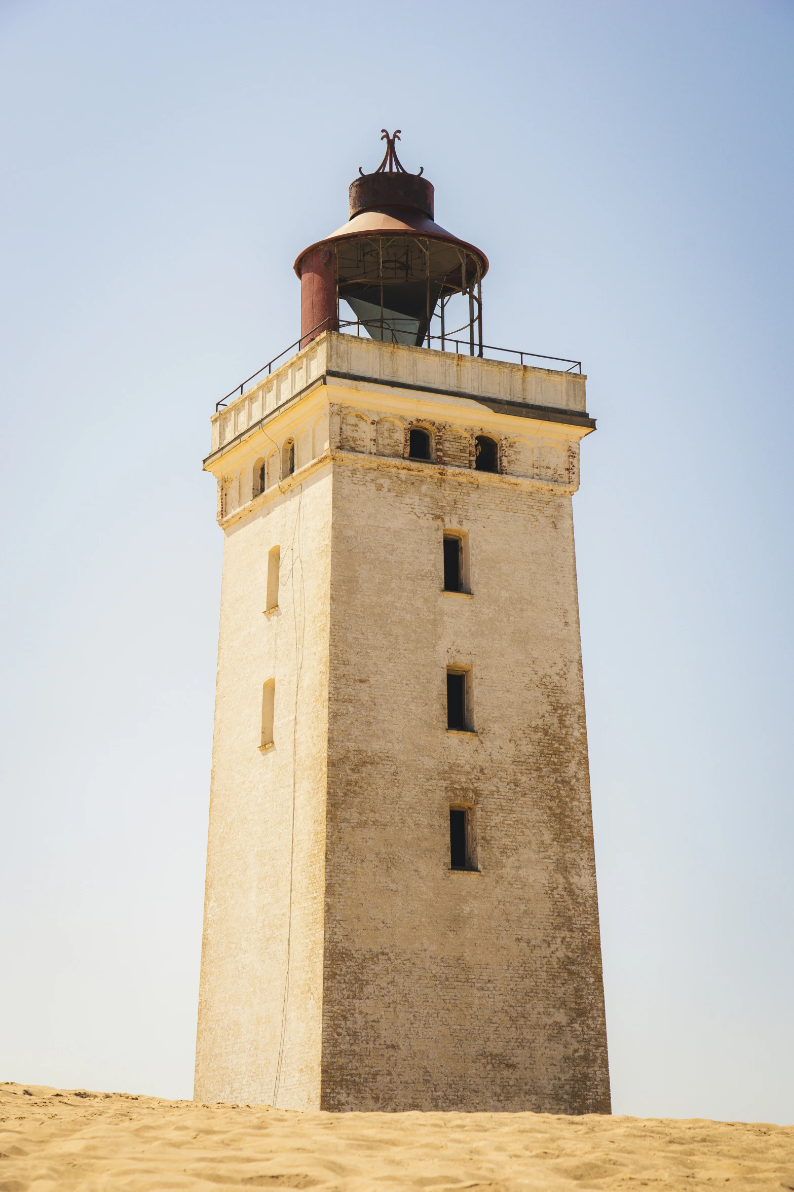 there is an old lighthouse with a large tower