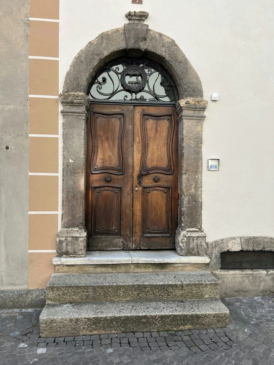 the front door to an apartment is decorated with decorative accents