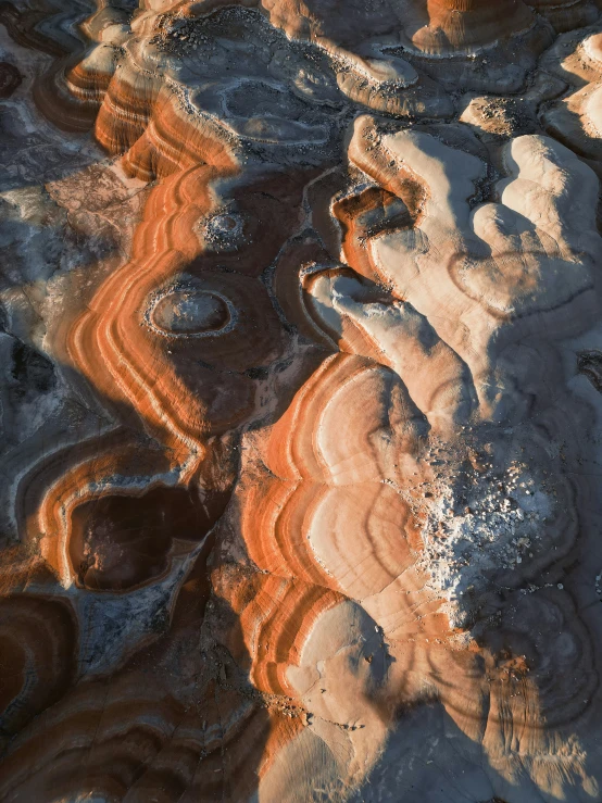 rock formations with many small dots of sand on them