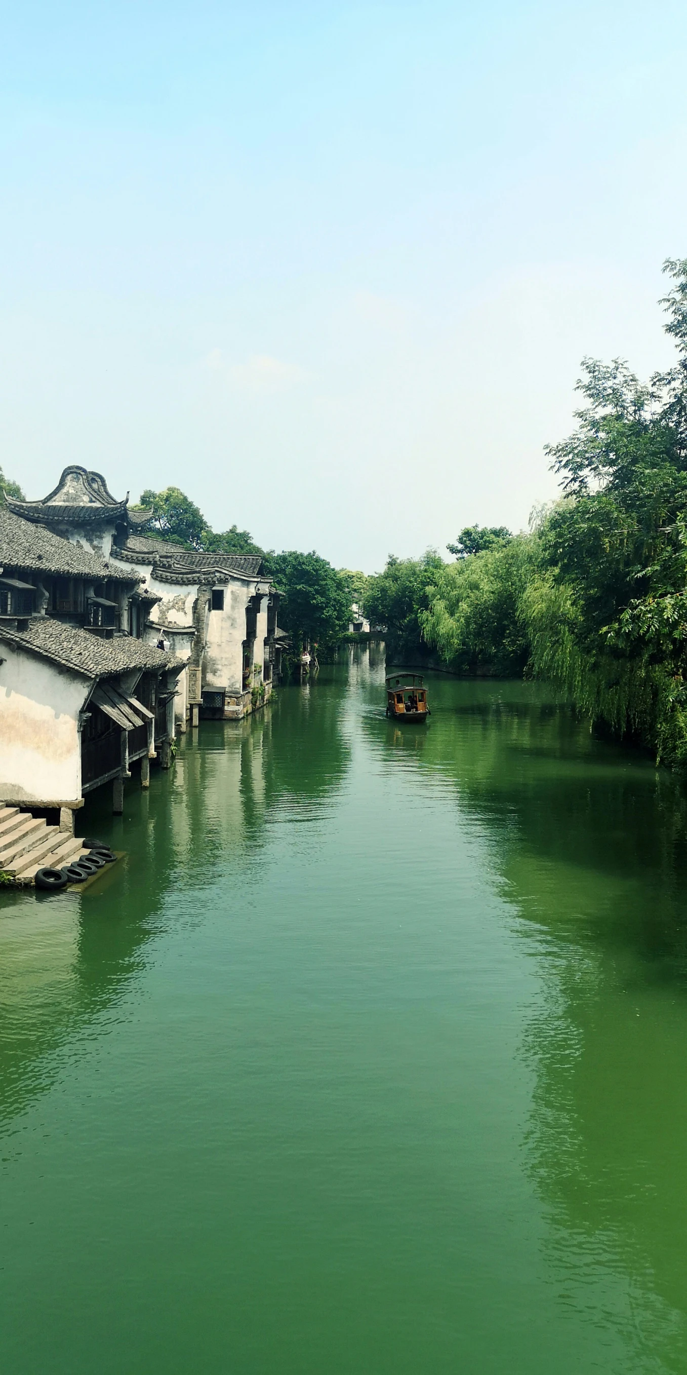 several old structures along an waterway in a city