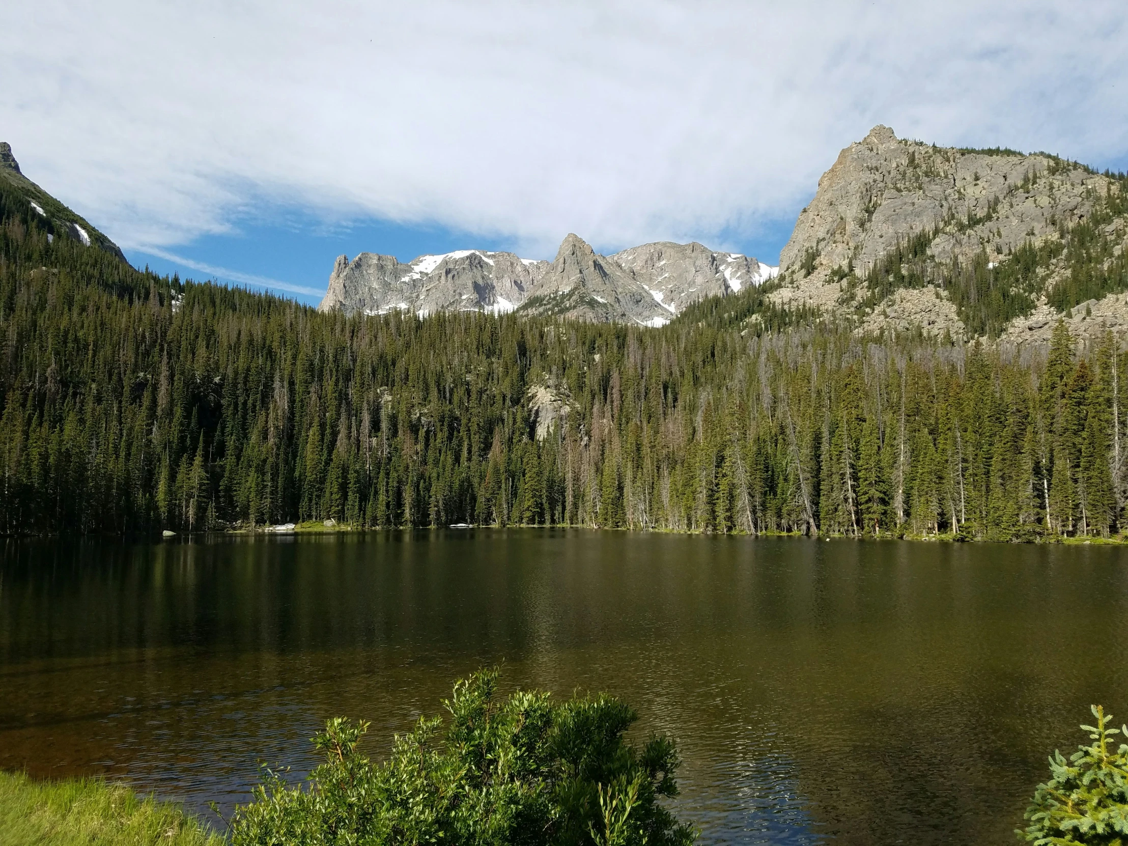 a mountain with a lake in front of it