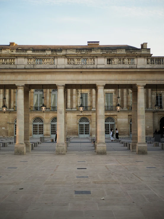 a large building that has some benches in front of it