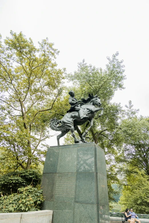 there is a statue of a person riding a horse