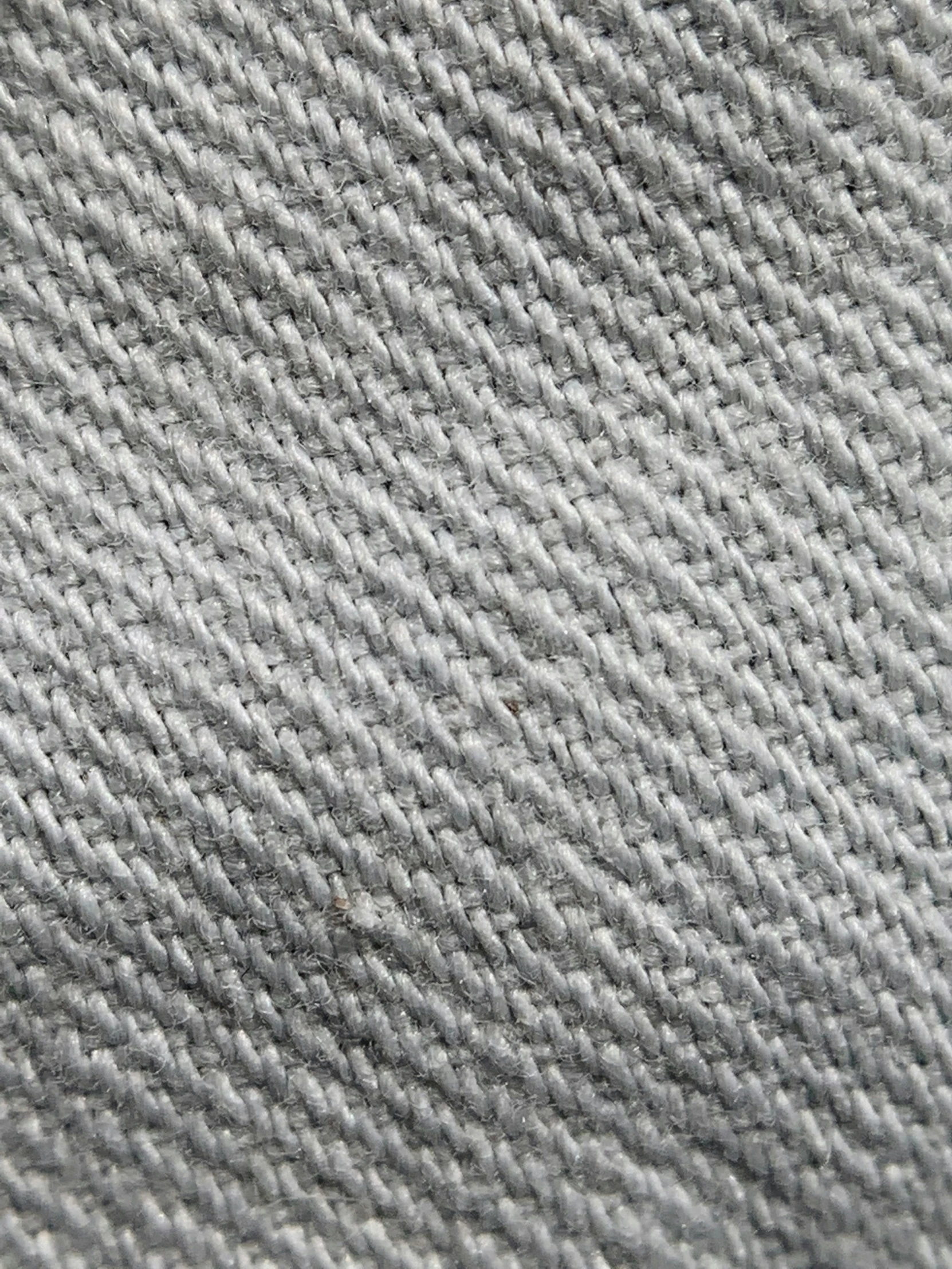 an up close view of the material with some tiny holes