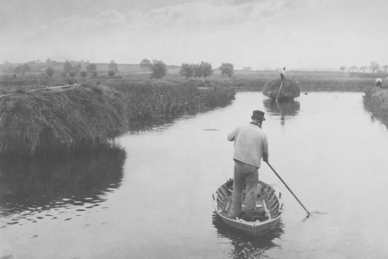 a man rowing a small boat across the water