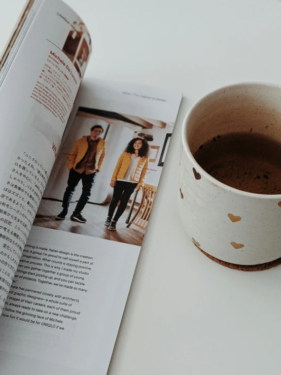 a magazine opened to show a cup of coffee