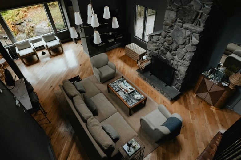 aerial view of living room with two sofas and a fireplace