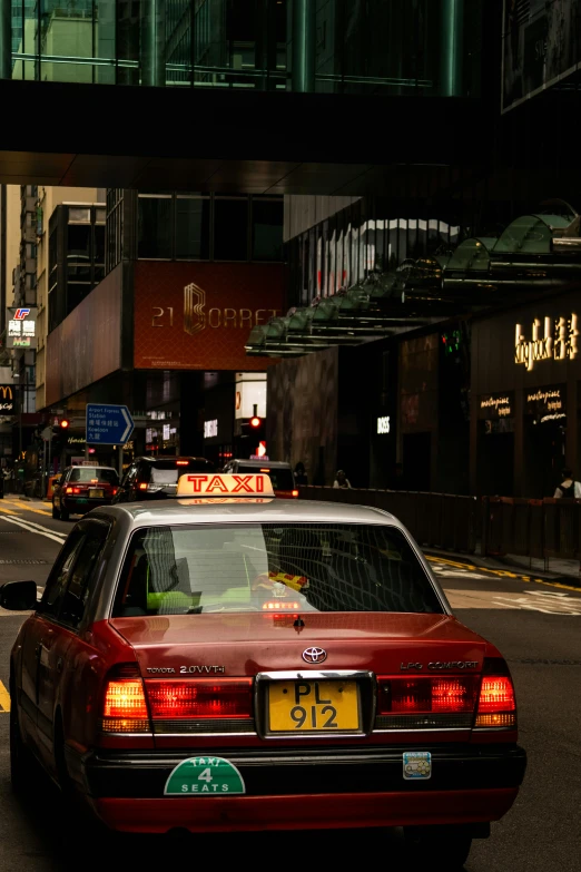 cars are on the street in the city at night