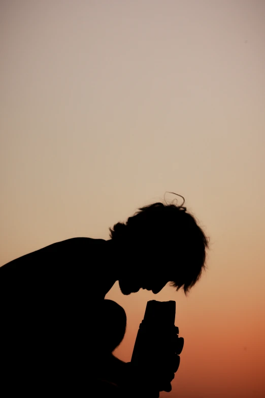 a man with a phone that has soing in his hand