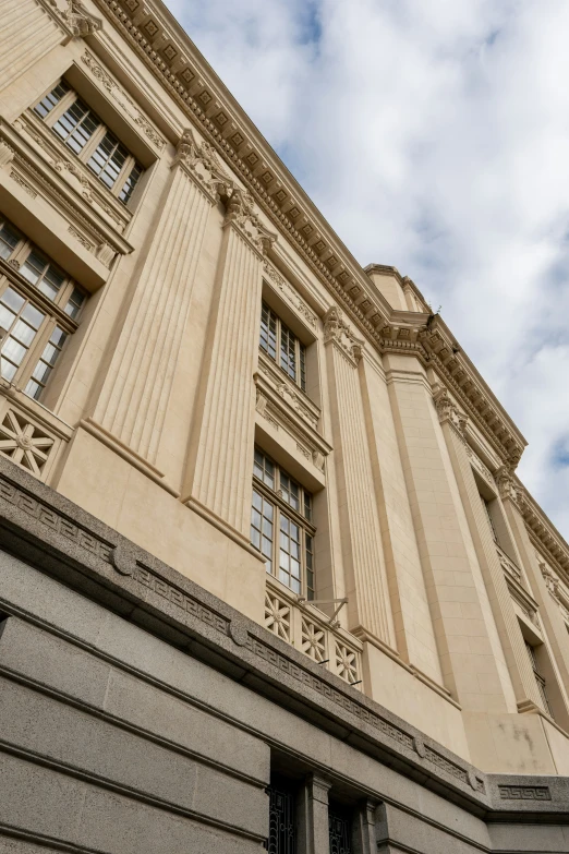 a clock on a building near the water