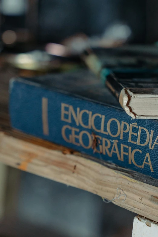 a couple of books that are on top of a table