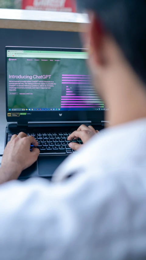 a person is looking at an open laptop