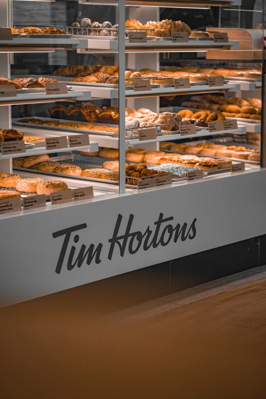 a store counter with a display of pastries