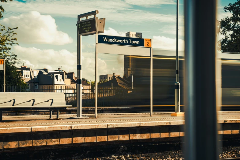 the train station is empty with train arriving