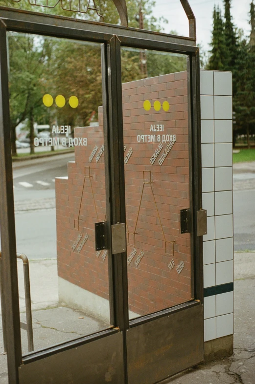 a parking meter in front of a brick building