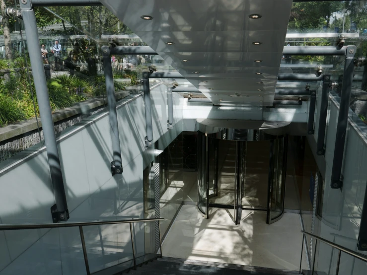 inside of an atrium building with tall metal railings
