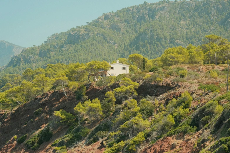 an image of a house on the side of a hill