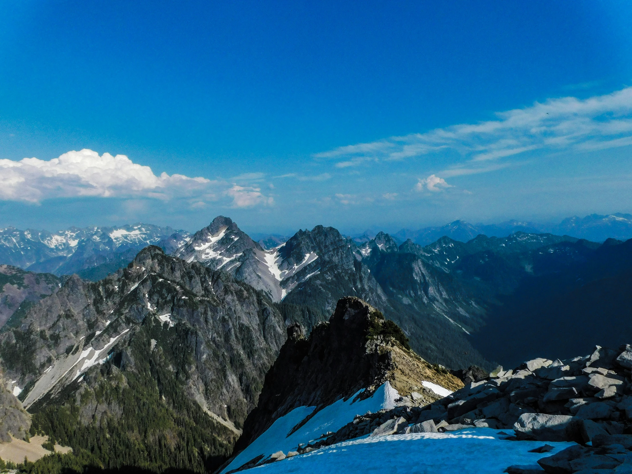 a mountain with some rocks and snow on it