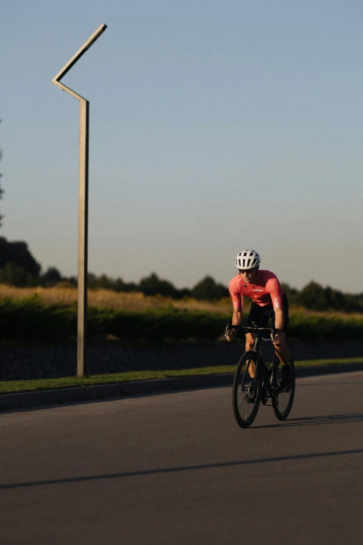 the bicyclist is going down the road