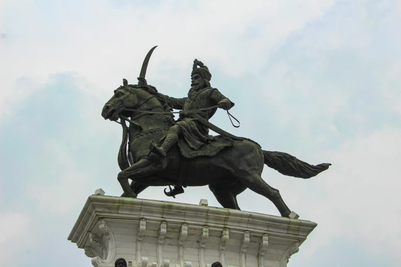 the statue of a man riding on the back of a horse