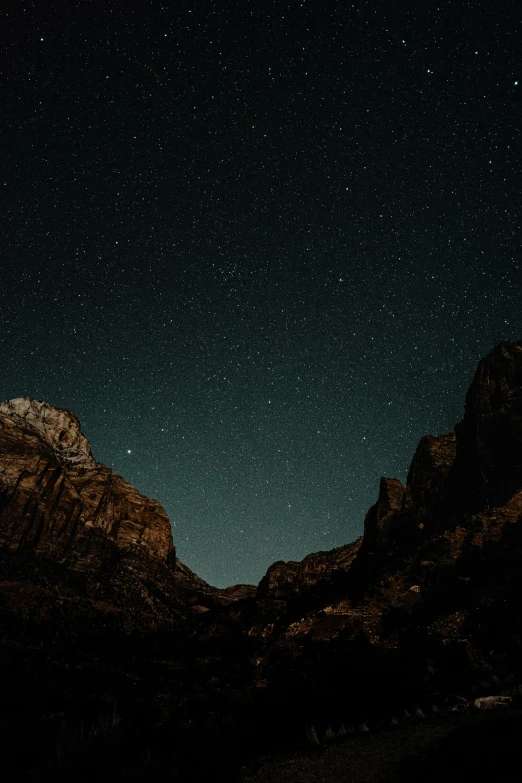 starry night sky and hills with stars in the distance