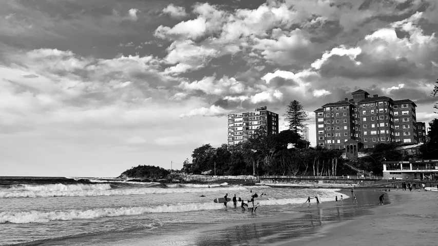 some people in the water some buildings and trees