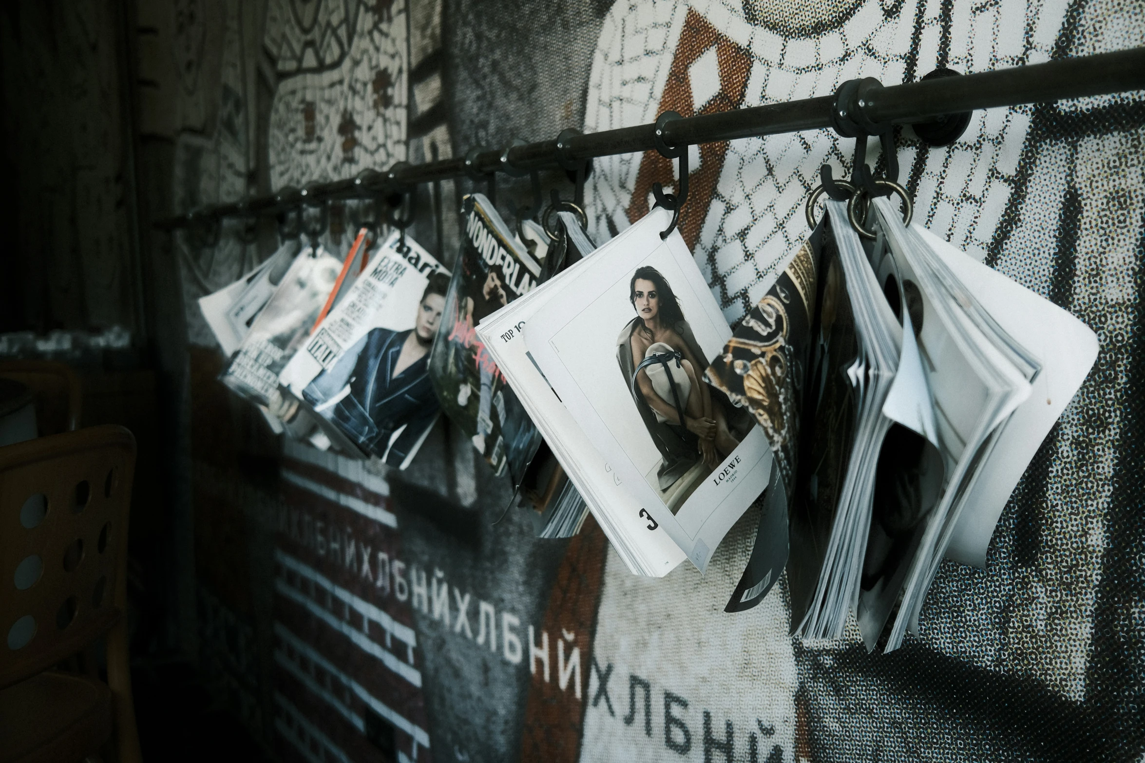 a few newspapers are hanging on the wall