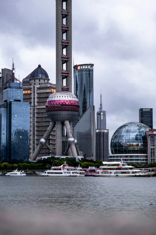 a large city with tall buildings on a cloudy day