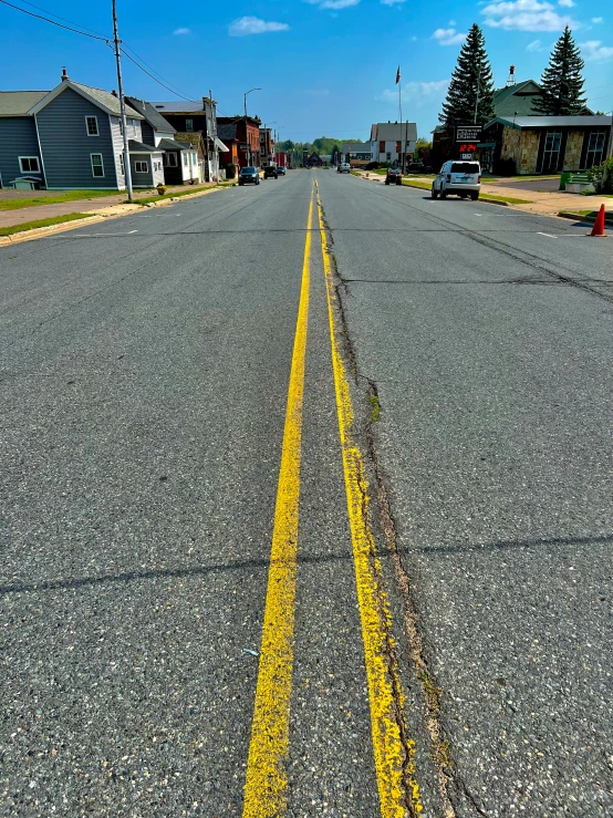 the sidewalk is paved and empty of vehicles