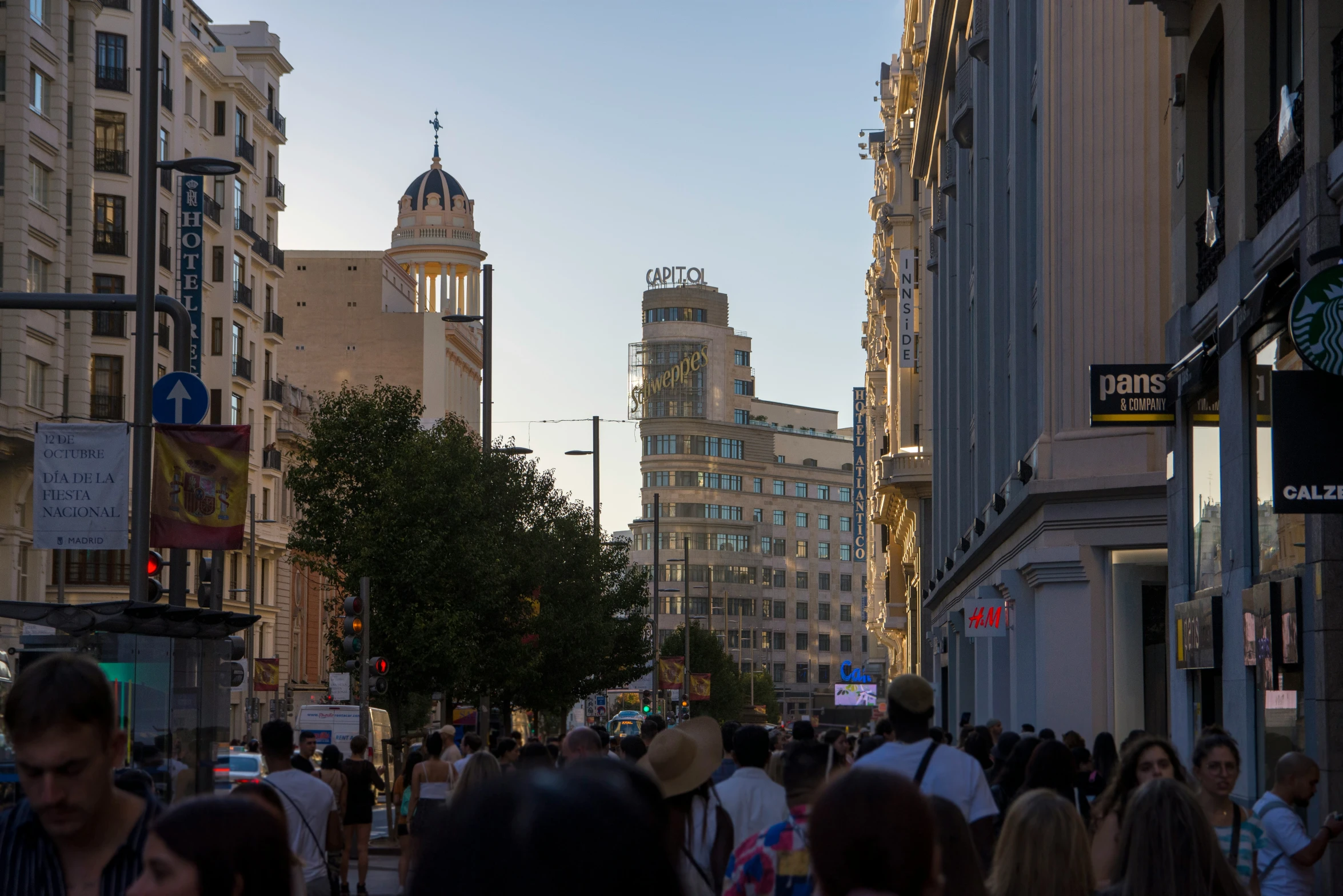 a busy city street lined with tall buildings