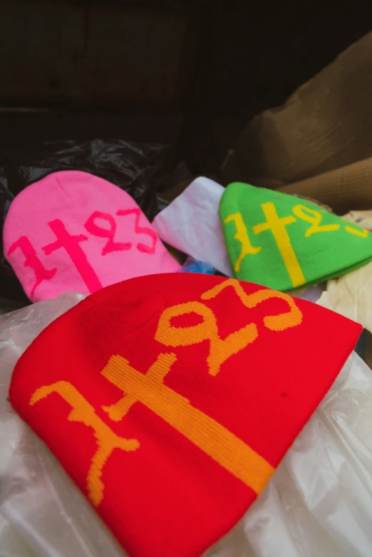 colorful hats with numbers and symbols are shown