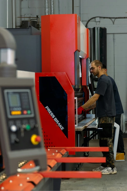 a man using a milling machine in a factory