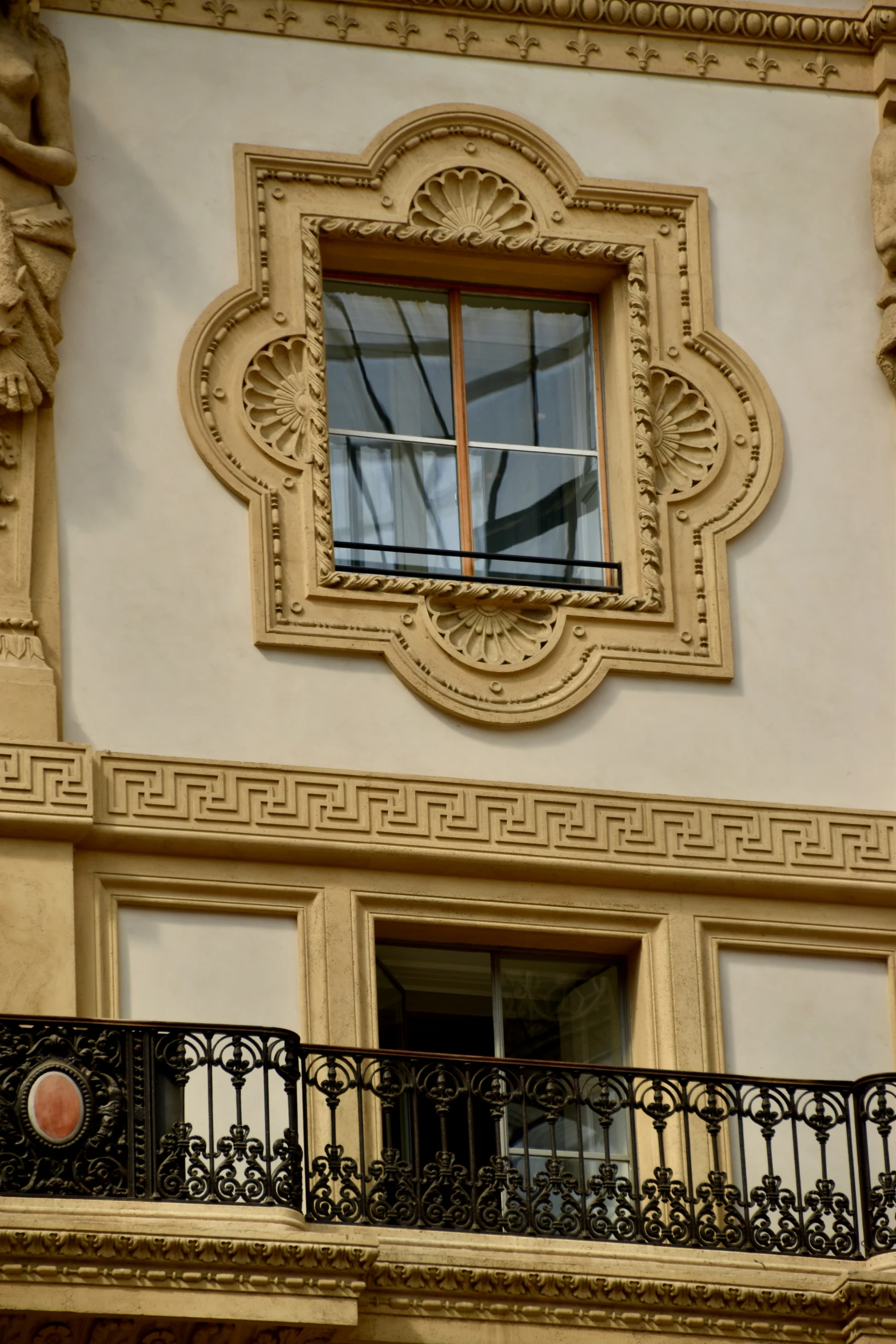 the balcony of an apartment building has a decorative decoration on it