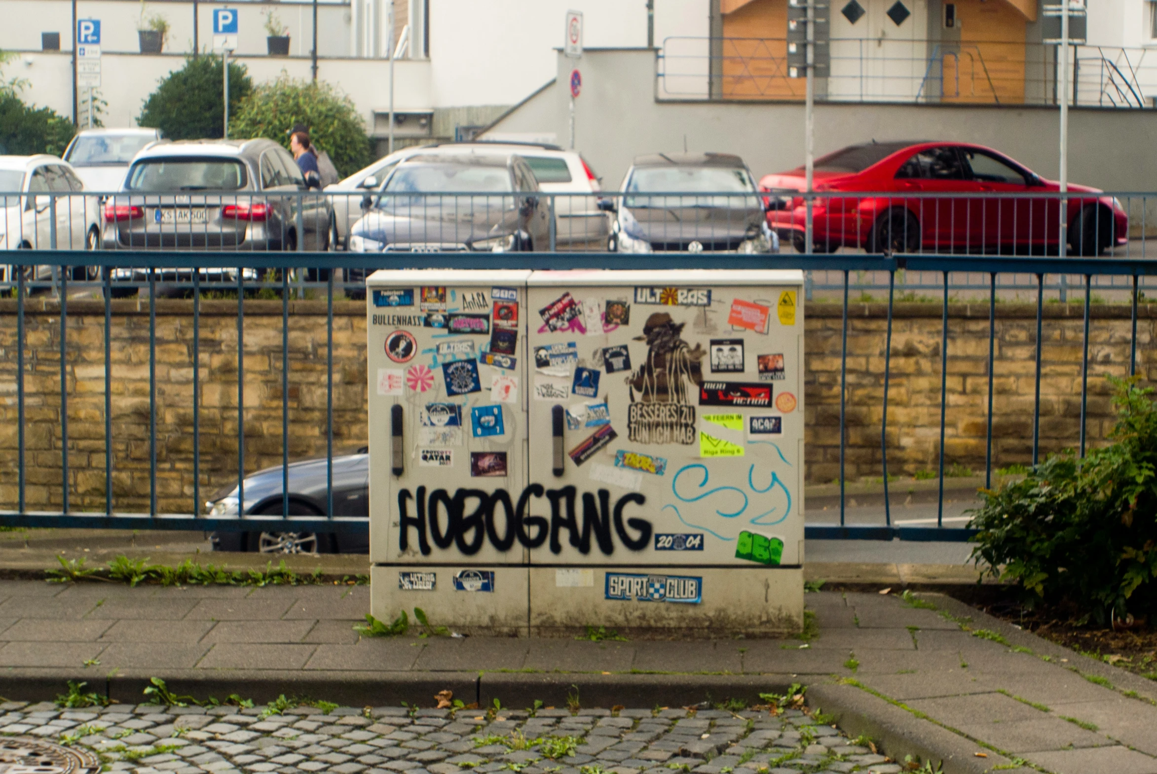 a refrigerator sitting on the side of the street