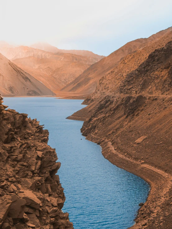 a river in a mountain area, with a hillside