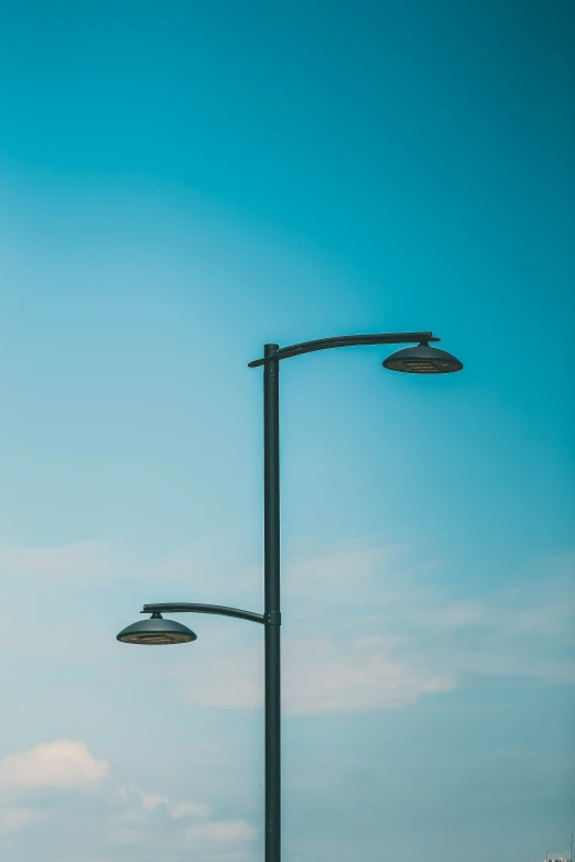 a couple of street lamps that are on a pole