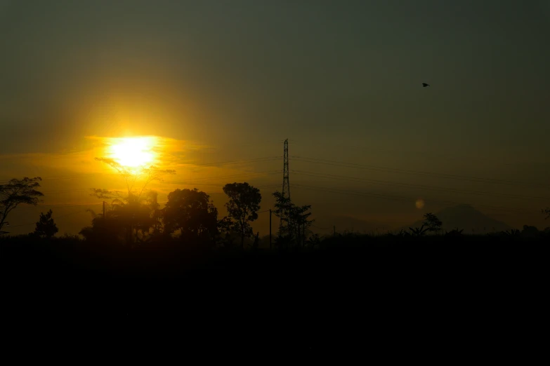 a setting sun in the middle of the evening