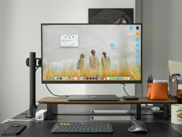 a computer monitor sits on top of the desk