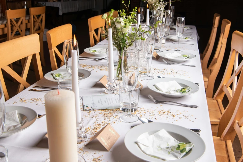 a table set for dinner with a number of dishes