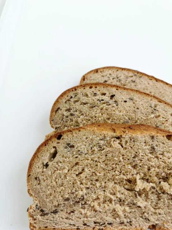 slices of white bread arranged on top of a white surface