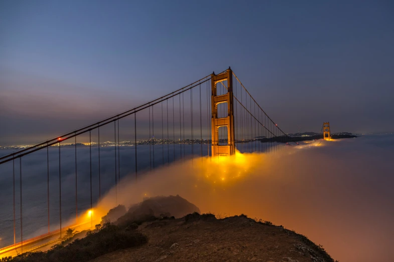 a long exposure po of the golden gate bridge at night