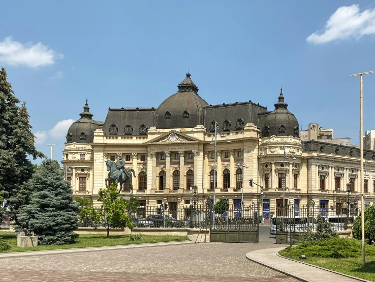 a large yellow building with dome and turrets