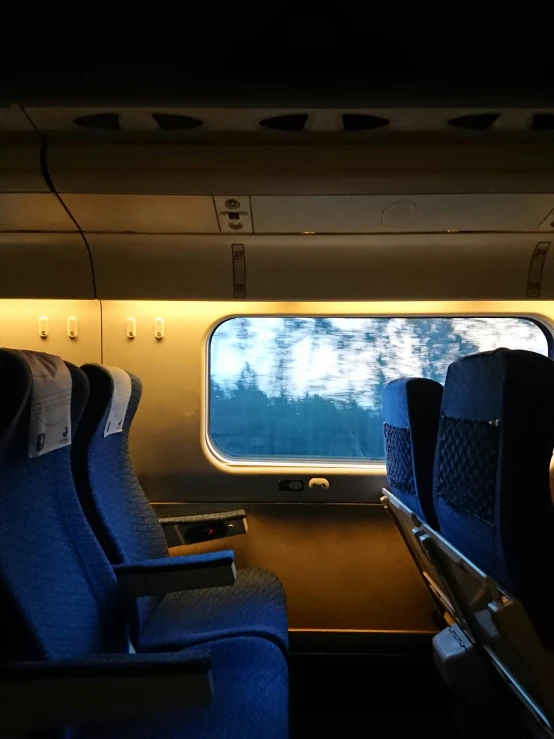 the seats in the cabin of an airplane have empty