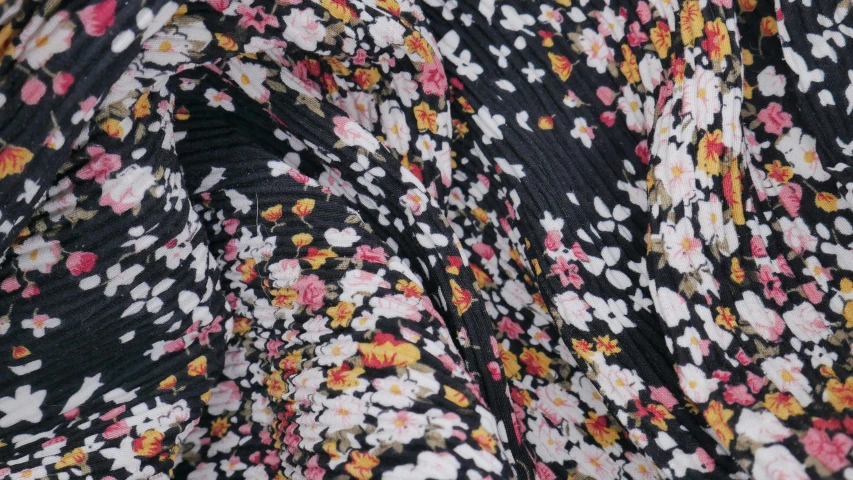 a dress with many flowers on it is black and white
