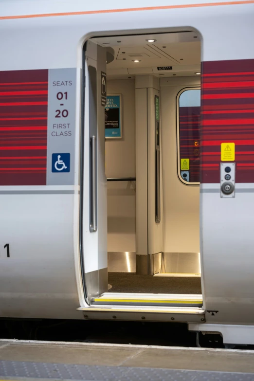 a train with doors open and empty on the floor