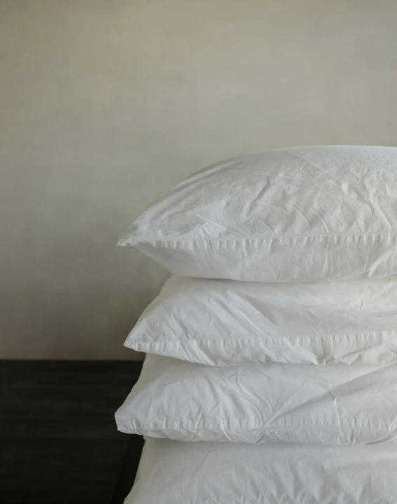 a stack of pillows sitting on top of each other