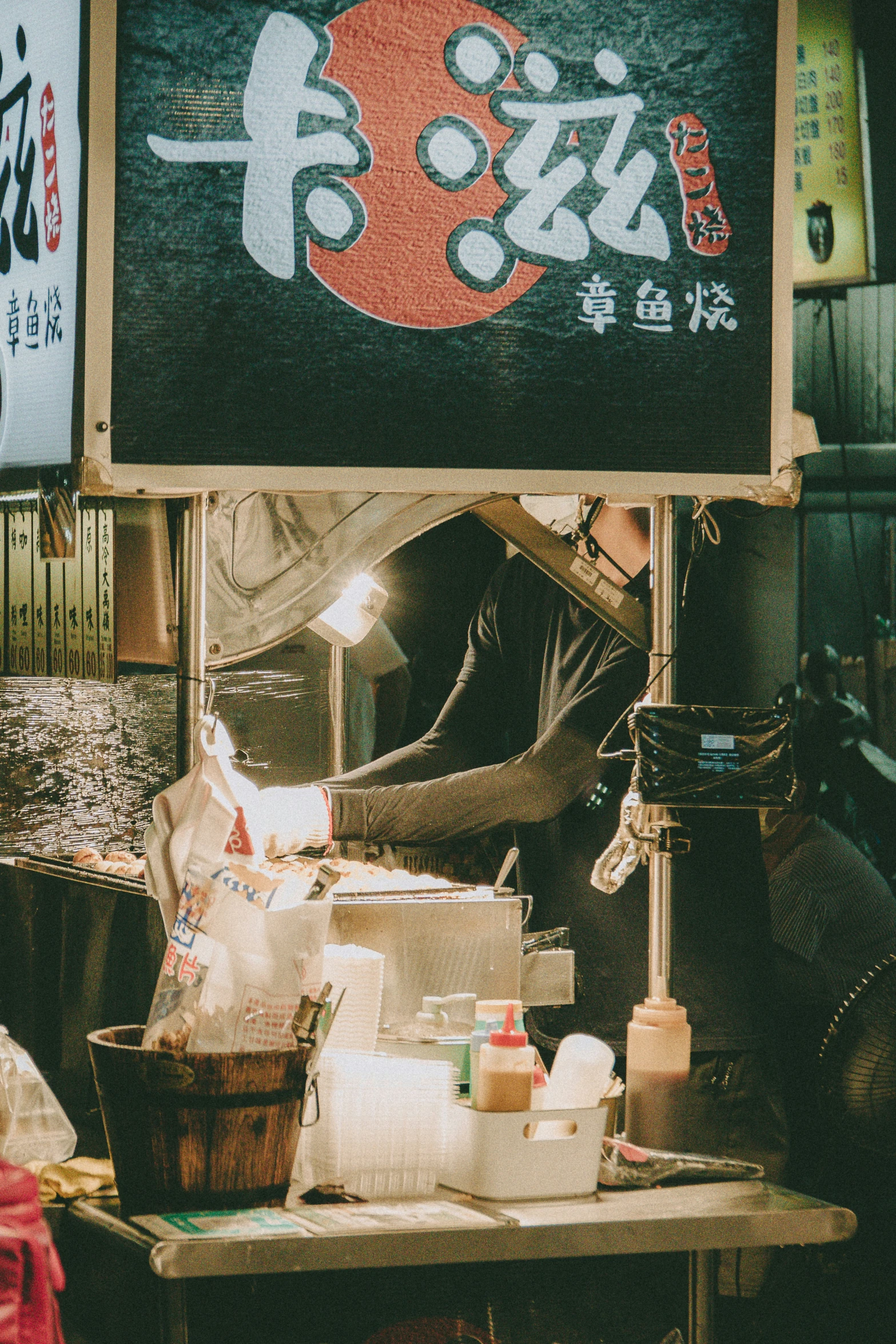 a food stand in china with asian signs on it