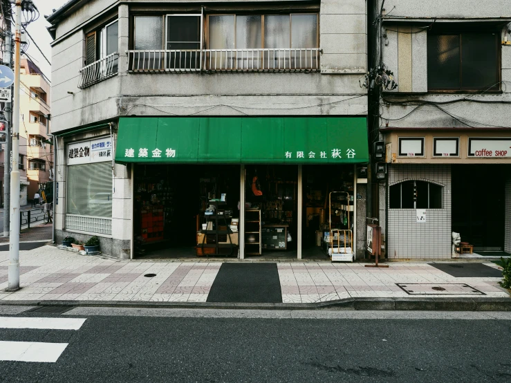 a small asian store on a street corner