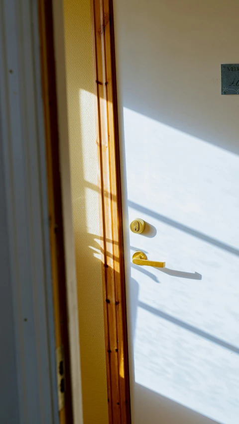 some scissors laying across a door and some windows